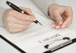 signing on a divorce document taking best divorce law services